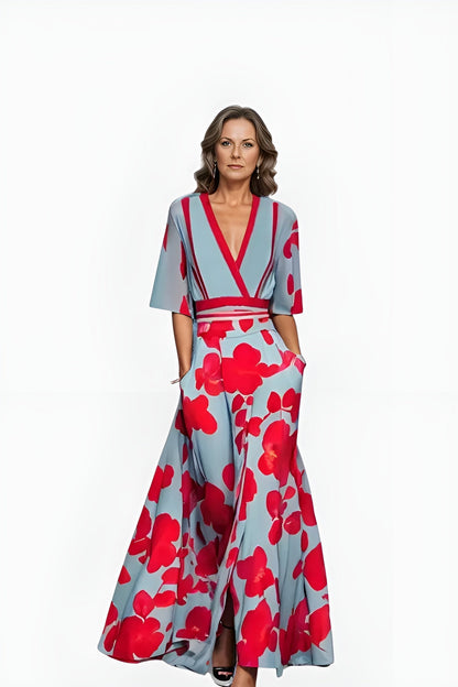 Jumpsuit Floral Azul Elegante para Mujeres con Cuello en V Cruzado, Mangas de Codo y Piernas Anchas con Cinturón