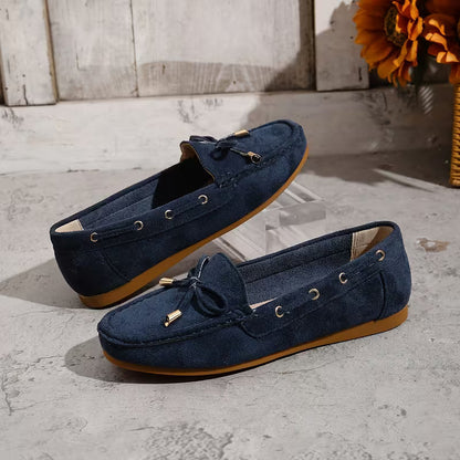 Mocasines cómodos para mujeres con detalle de lazo y ribete de tachuelas, estilo plano y fácil de poner