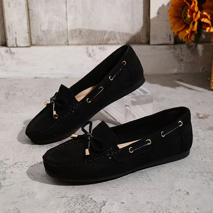 Mocasines cómodos para mujeres con detalle de lazo y ribete de tachuelas, estilo plano y fácil de poner