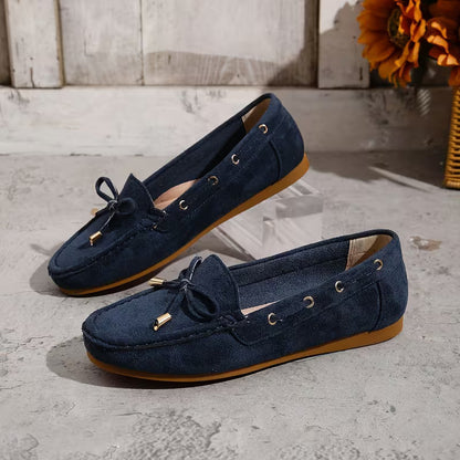 Mocasines cómodos para mujeres con detalle de lazo y ribete de tachuelas, estilo plano y fácil de poner